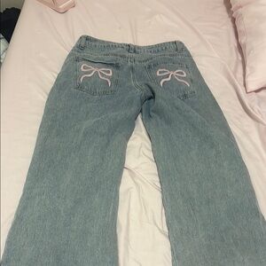 Edikted Blue and Pink Flare Jeans with Feminine Bow Details